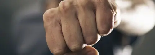 A close up of someone 's fist with their fingers in the air.
